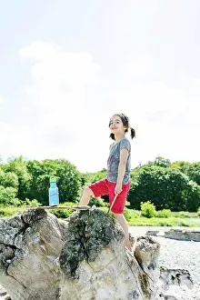 People In Nature Prints: Straight on portrait of a young girl smiling at the beach