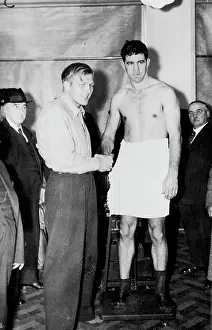 1937 Prints: Strickland And Neusel Weigh In For Big Fight -- Walter Neusel (left)