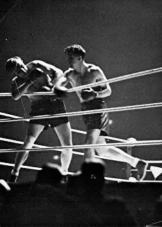 1937 Prints: Strickland (on right) lands punishing right hand blows on Neusel