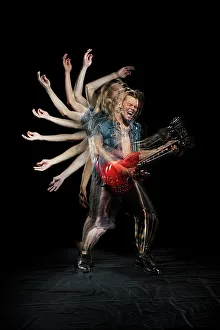 Opening Prints: Stroboscopic photos of young man playing electric guitar on black background