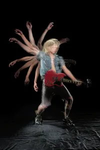 Opening Prints: Stroboscopic photos of young man playing electric guitar on black background