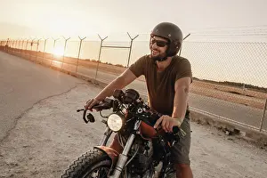 Protection Prints: Strong man driving motorcycle