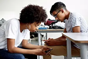 Students Prints: Students in classroom using smart phones