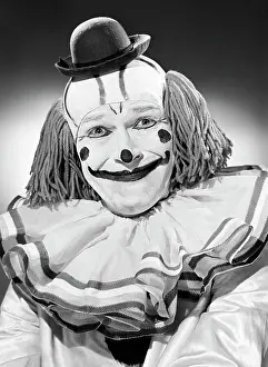 Arts Culture And Entertainment Prints: Studio portrait of clown smiling