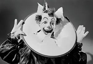 Arts Culture And Entertainment Prints: Studio portrait of clowns head thought paper
