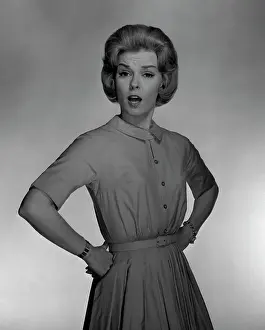Arms Akimbo Prints: Studio portrait of mid adult woman