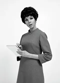 Notepad Prints: Studio portrait of secretary holding notepad