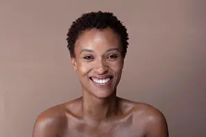 Bame Prints: Studio portrait of smiling shirtless woman