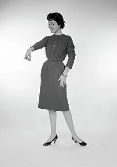One Young Woman Only Prints: Studio portrait of young woman pointing