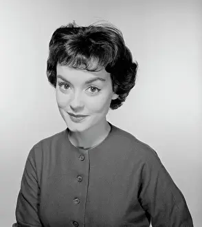 Studio portrait of young woman smiling