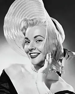 Necklace Prints: Studio portrait of young woman wearing hat, smiling