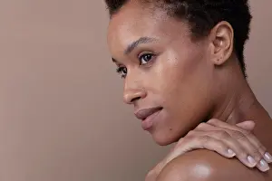Bame Prints: Studio shot of woman touching shoulder