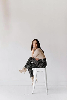 Middle Eastern Prints: Studio shot of young woman sitting on stool