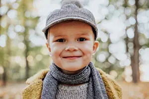 Leather Prints: Stylish boy having fun in autumn city park