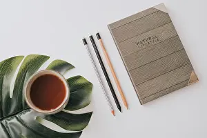 Notebook Prints: From above stylish notebook with wooden cover composed with row of pencils