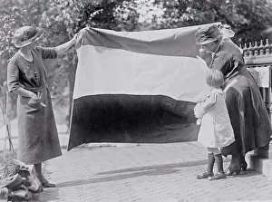 Early 1900s People Prints: Two suffragettes showing banner to young girl ca. between 1910 and 1930