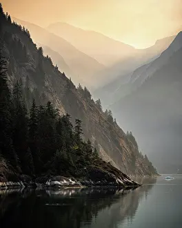 Rise Prints: The sun rise is enhanced by smoke from fires in interior Alaska as we sail into Tracy Arm