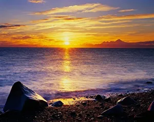 Oceans Prints: Sunset over Cook Inlet with Iliamna Volcano in Lake Clark National Park on the horizon