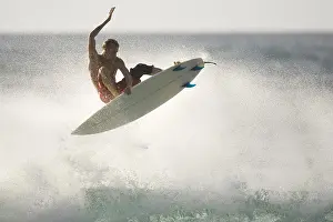Surfing Prints: Surfer flying off wave, Oahu