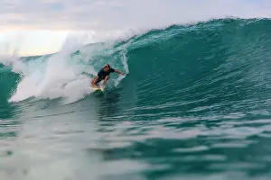 Agility Prints: Surfer riding wave in sea