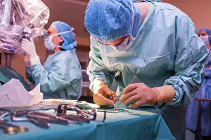 Surgery Prints: Surgeon performing cochlear implant surgery