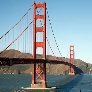 Mountain Range Prints: Suspension bridge across a bay