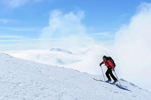Model Release Prints: Sweden, Norrbotten. Woman backcountry skiing in the Abisko Alps. (MR)