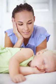 Innocent Prints: Sweet, sleeping and mother with baby on bed for bonding