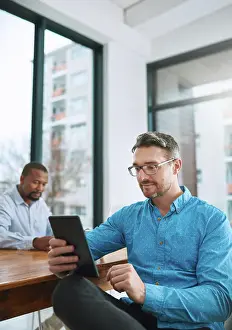 Banking Prints: Tablet, glasses and businessman in office reading online research for finance stock market