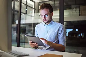 Tablet Prints: Tablet planning, night research and businessman working on the internet in a dark office at work