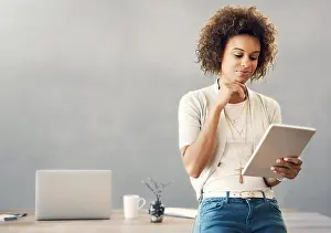 Mockup Prints: Tablet, thinking and web development with business woman in office for information or research