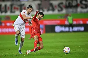 Germany Prints: Tackle, foul by Atakan Karazor VfB Stuttgart (16) on Eren Dinkci 1