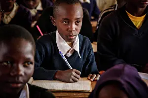 Sweater Prints: Tanzanian student sitting at desk in school