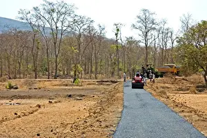 Progress Prints: Tar bitumen road under construction in remote village in Thane district near Mumbai Bombay ; Maharashtra ; India