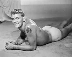 Tattoo Prints: Tattooed Nude Bodybuilder Smiles at Camera c.1956