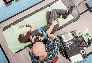 Gifted Prints: Tattooist drawing on arm of client