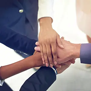 Huddle Prints: Team building, business and hands in solidarity in office for goal support