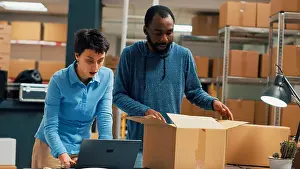 Logistics Prints: Team of entrepreneurs packing order for shipment