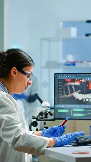 Analysis Prints: Team of microbiology scientists discussing about virus development