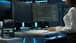 Expert Prints: Technician in data center provides technical support to users