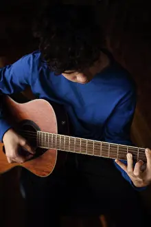 Guitar Prints: Teen buy plays acoustic guitar