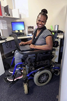 Desktop Computer Prints: Teen with Cerebral Palsy working in an office