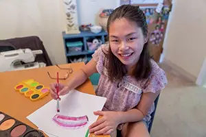 Paintbrush Prints: Teen girl with a Learning Disability using paints