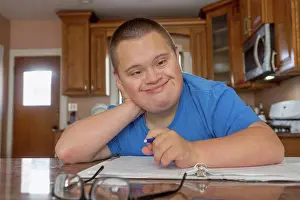 Disorder Prints: Teen with Down Syndrome studying