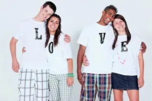 Small Group Prints: teenage couples with their t_shirts spelling ´love´