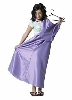 Decision Prints: Teenage girl holding a dress