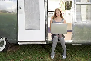 Caravan Prints: A teenage girl using a laptop