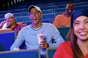 Beverage Prints: Four teenagers sitting in a movie theater