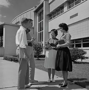 Full Length Prints: Teenagers talking in front of school