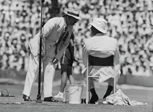 Group Of People Prints: Tennis Incident - Referee Cliff Sproule speaking to American manager Frank Shields after halting play in the second set